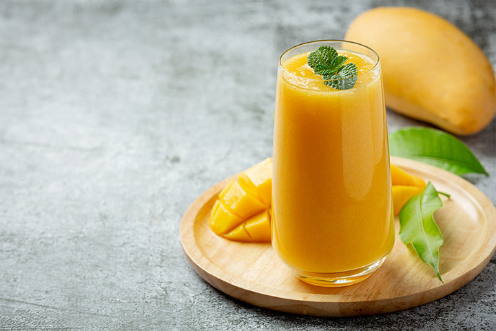 Glass of mango shake and mango | mango shake benefits