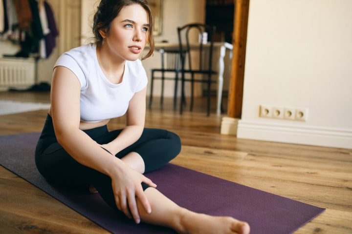 a woman doing yoga to reduce arthritis pain