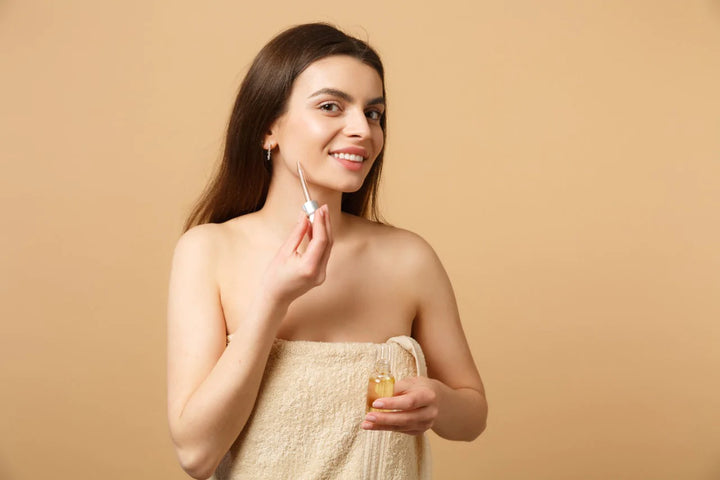 woman performing skincare | face serum for glowing skin