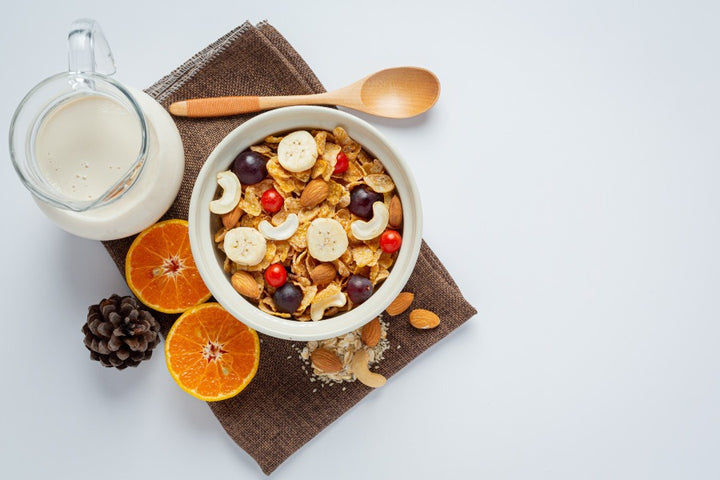 a bowl of muesli and some fruits | Discover the Amazing Muesli Benefits for Skin & Health