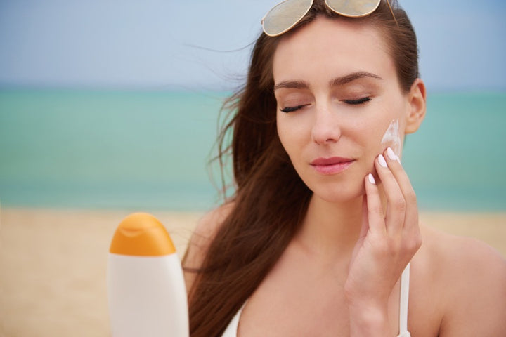 a woman is using sunscreen | Do You Need A Sunscreen on A Cloudy Day