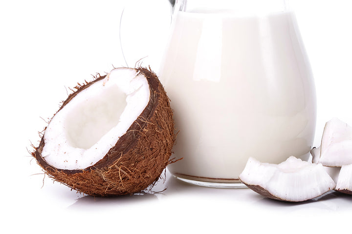 Coconut and Milk in glass jug | coconut milk for hair