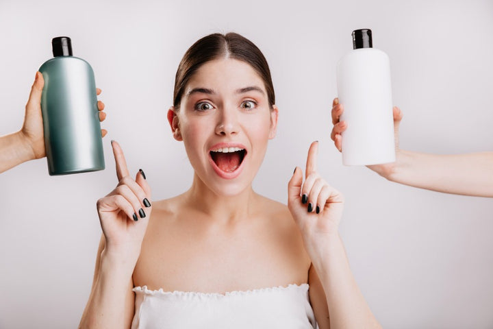 joyful woman pointing towards hair conditioners