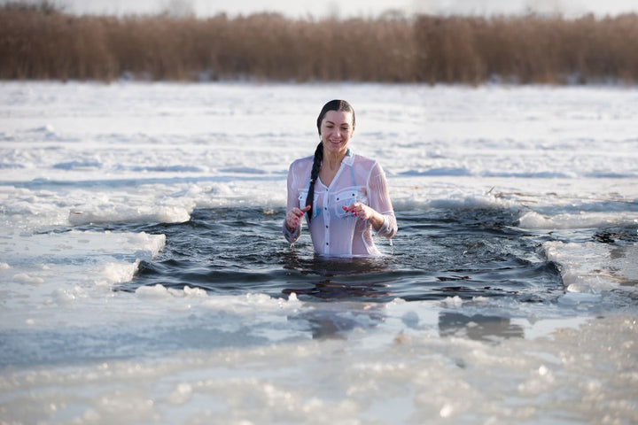 a woman taking ice bath to cure sore muscles