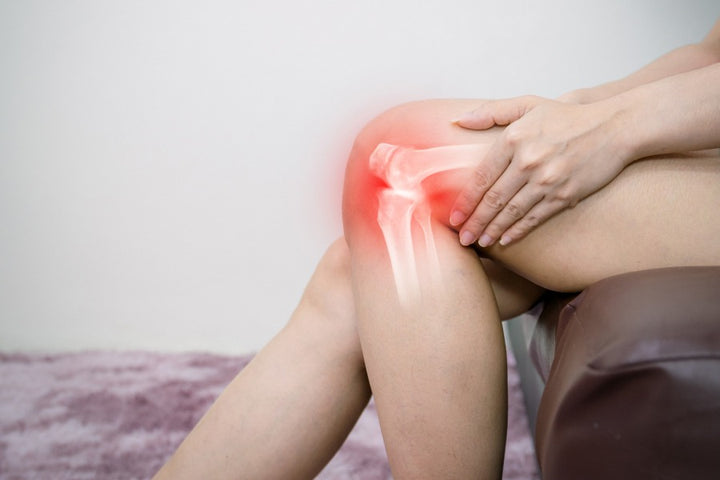 a woman holding her knees | Last One Will Blow Your Mind 8 Tips for Better Bone Health