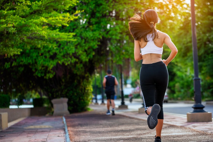a woman is running in the park | Relieve Stress With These Best Outdoor Activities for Women