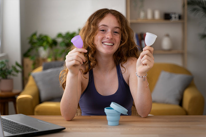 Woman holding menstrual cup | Menopause Age In India
