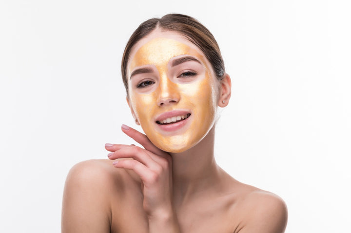 a woman using a face pack/face mask to get glowing skin