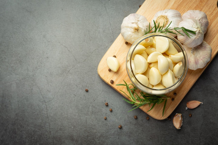 a bowl of garlic cloves