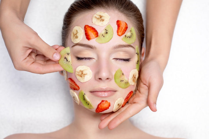 a woman enjoying fruit facial 