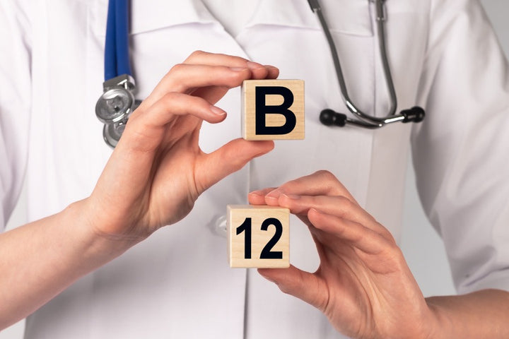 a doctor holding cubes of B & 12 (vitamin B12)