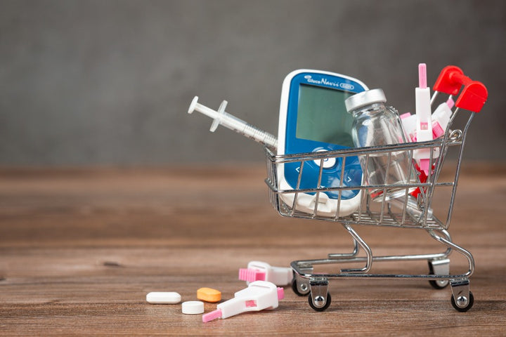 a small cart carrying injections and glucometer