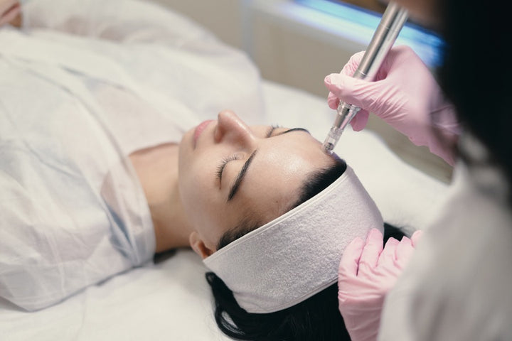 a woman getting microneedling treatment